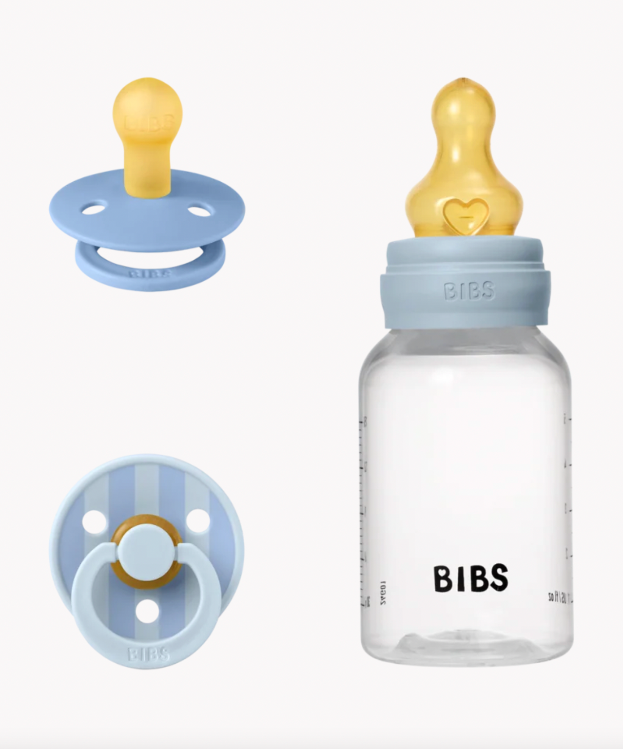 BIBS baby bottle and pacifier set on a clean white background, featuring a clear bottle with a light blue collar and yellow nipple, alongside two pacifiers in light blue and yellow.