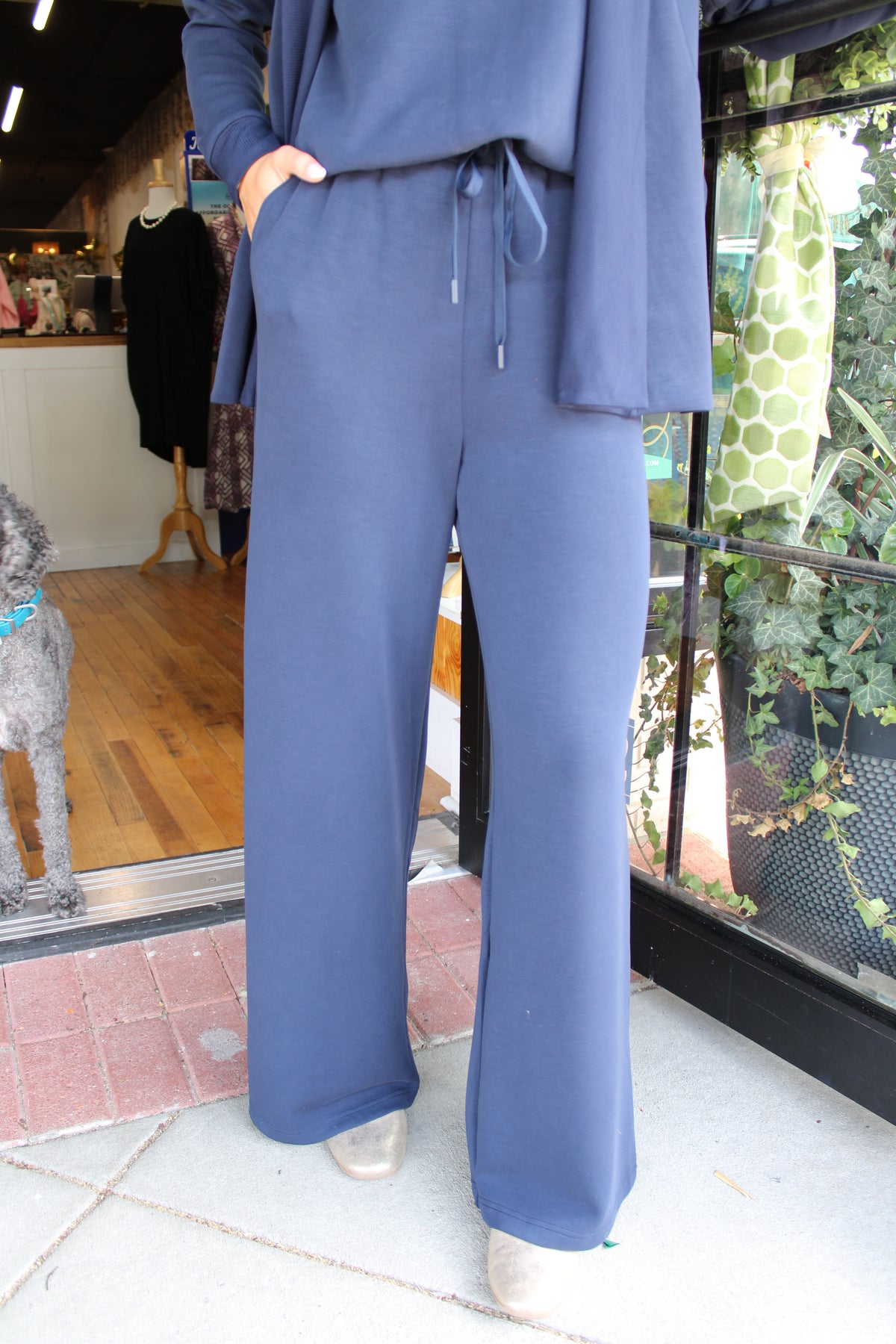 woman wearing navy blue pant set with drawstrings at the waist