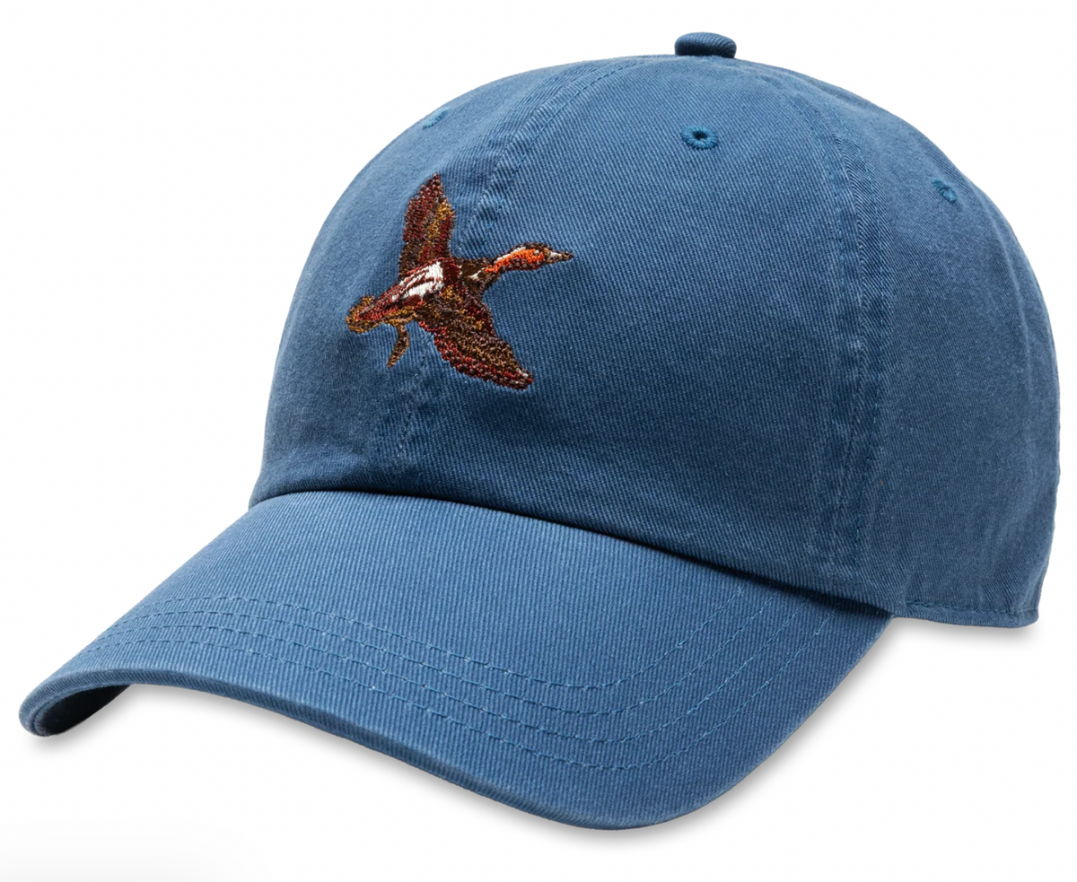 A blue cotton baseball cap featuring an embroidered brown and orange mallard on the front, set against a plain white background.