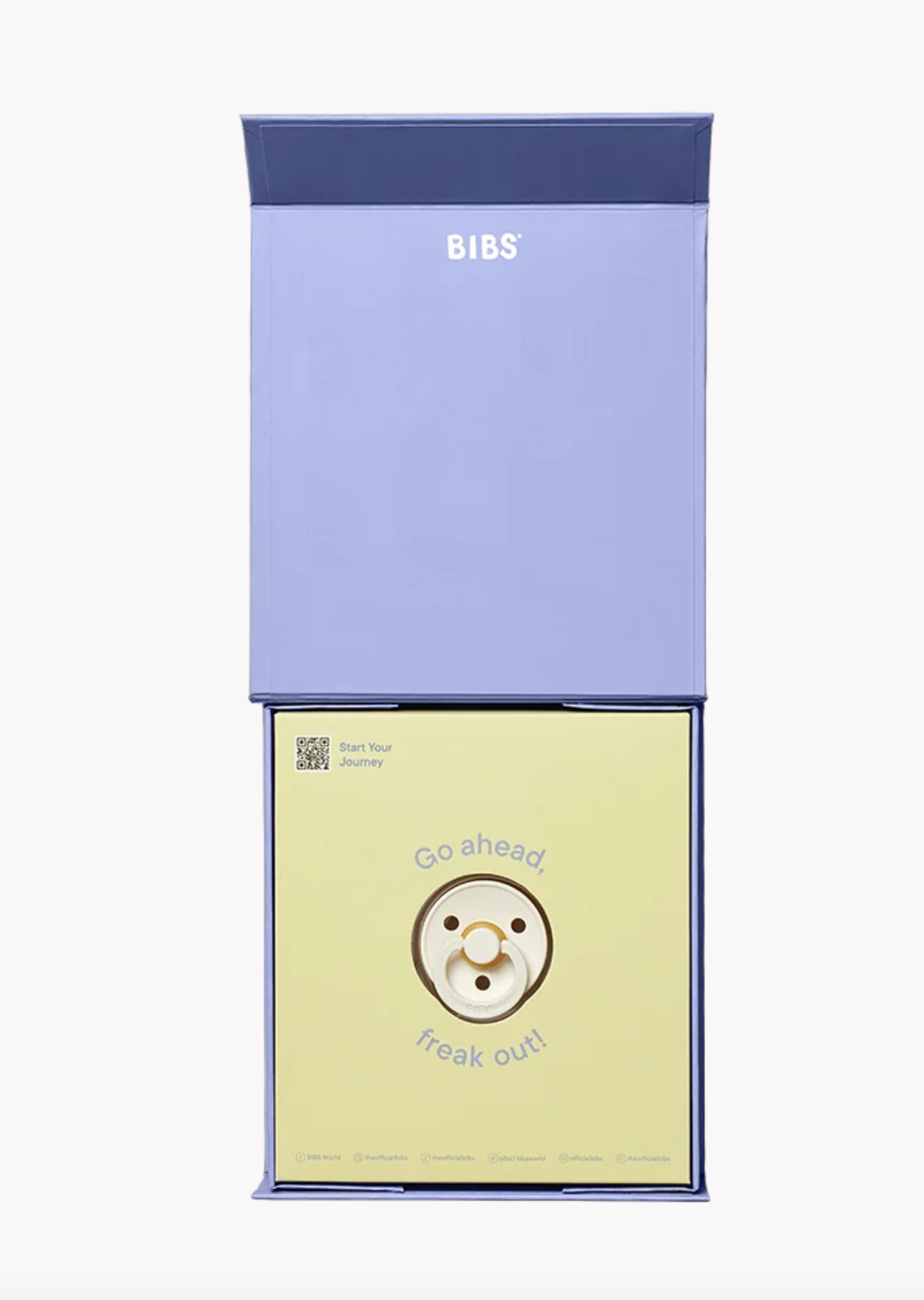 BIBS baby pacifier pouch packaging, featuring a light blue outer sleeve with the brand name 'BIBS' and a pale yellow inner pouch with a cartoon pacifier illustration and the text 'Go ahead, freak out!'.