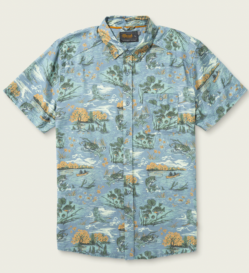 A short-sleeve button-up Hagood featuring a detailed outdoor fishing pattern in shades of blue, green, and orange, displayed flat against a light beige background.
