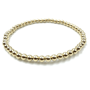 Gold-filled stretch bracelet by Erin Gray. The bracelet is made of gold-filled 4mm beads all around.